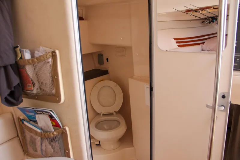 Slide: The Image of 2003 Grady-White Express 330 boat interior with bathroom and storage. - 47