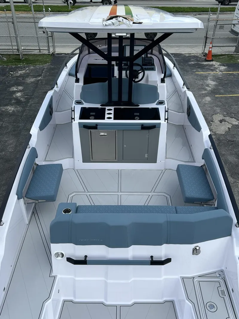 Slide: The Image of 2025 Ranieri 330LX boat interior with seating and helm station. - 13
