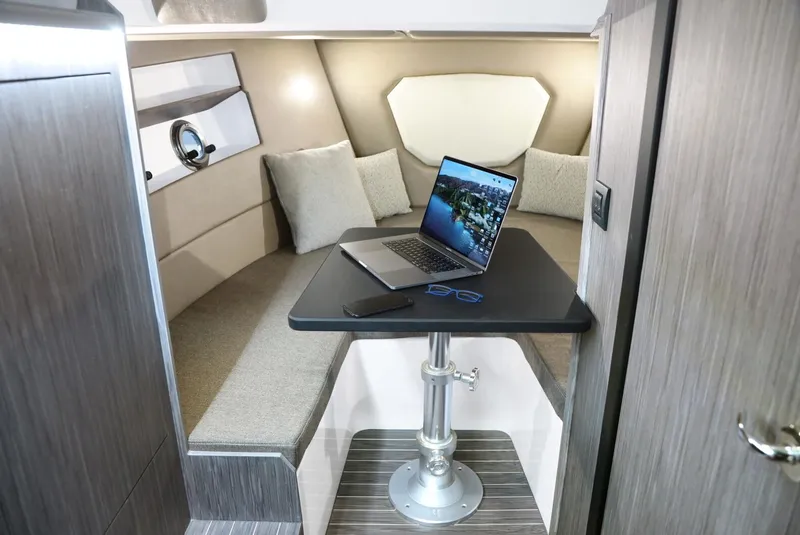 Slide: The Image of Interior of 2025 Ranieri 330LX boat with laptop on table. - 17