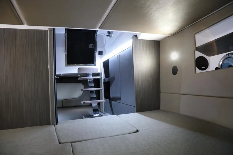 Slide: The Image of Interior cabin of 2025 Ranieri 330LX boat, featuring modern design and comfortable seating. - 19