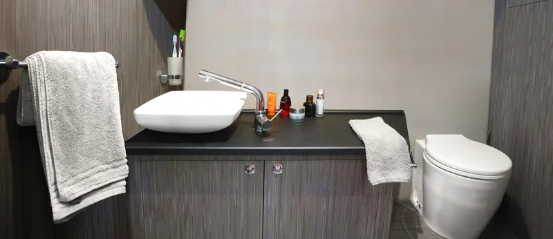 Slide: The Image of Modern bathroom with sleek sink, toiletries, and towels on a Ranieri 330LX, 2025 model. - 22