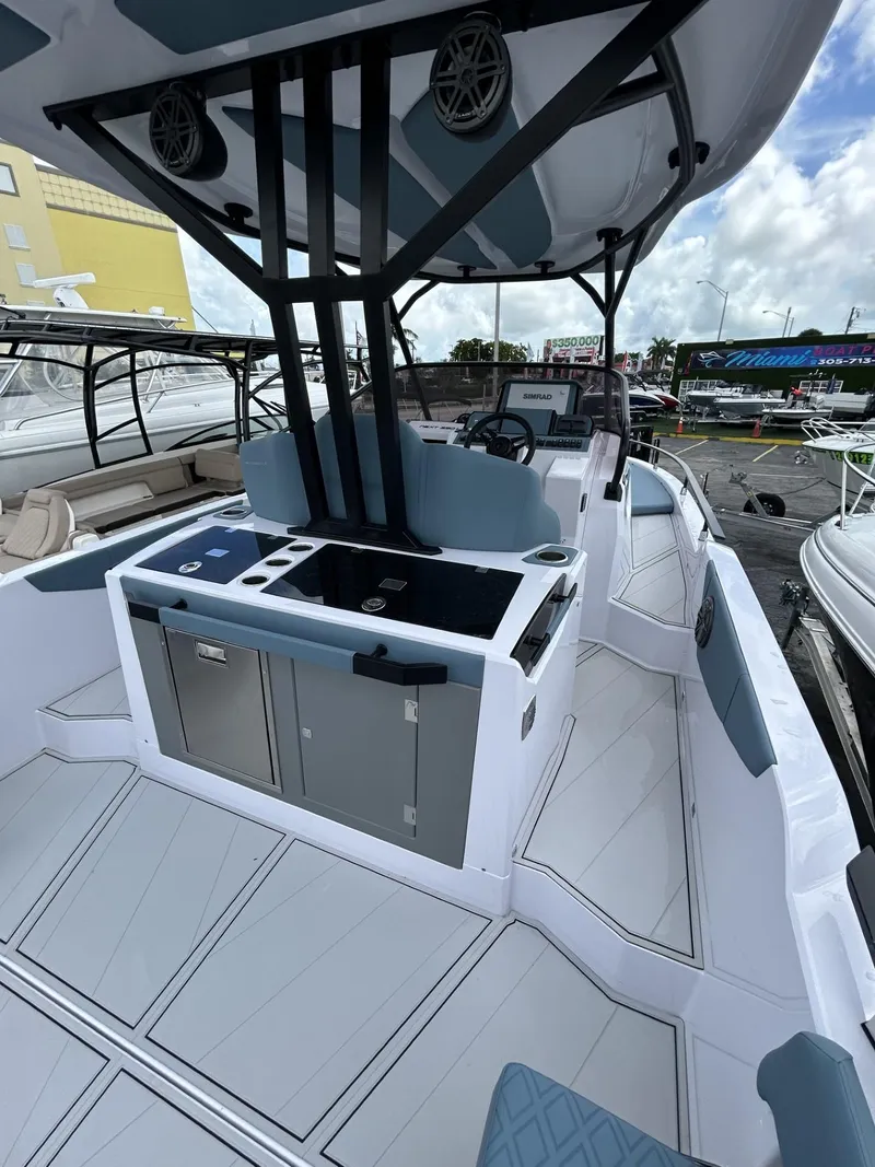 Slide: The Image of 2025 Ranieri 330LX boat interior with modern helm and seating. - 34