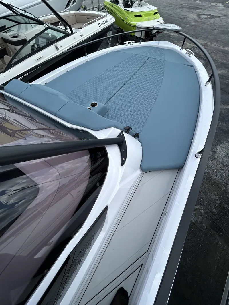 Slide: The Image of 2025 Ranieri 330LX boat with sleek design and blue deck. - 40