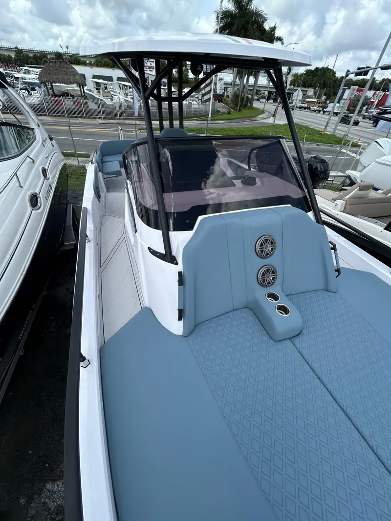 Slide: The Image of 2025 Ranieri 330LX boat with sleek design and modern features, docked at a marina. - 43
