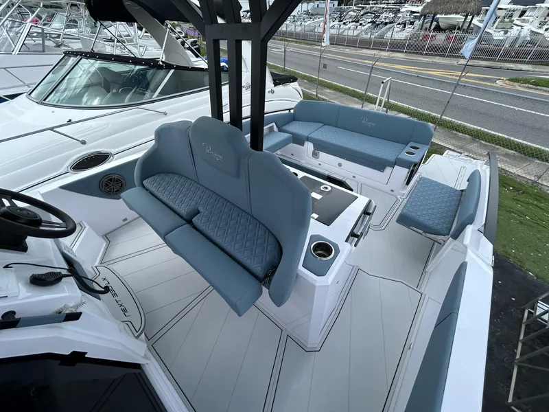 Slide: The Image of 2025 Ranieri 330LX boat interior with blue seating and modern design. - 44