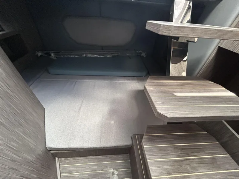 Slide: The Image of Interior cabin of 2025 Ranieri 330LX boat with modern wooden steps. - 47