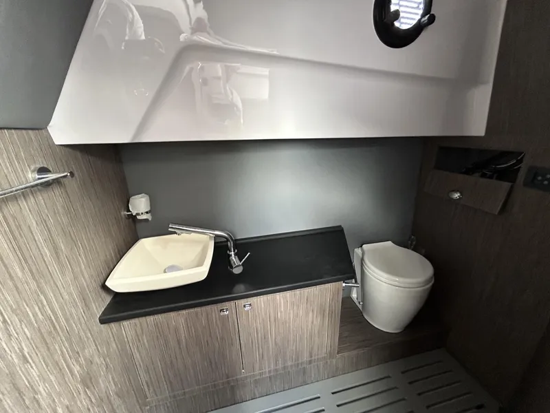 Slide: The Image of Modern bathroom interior of 2025 Ranieri 330LX boat with sink and toilet. - 49