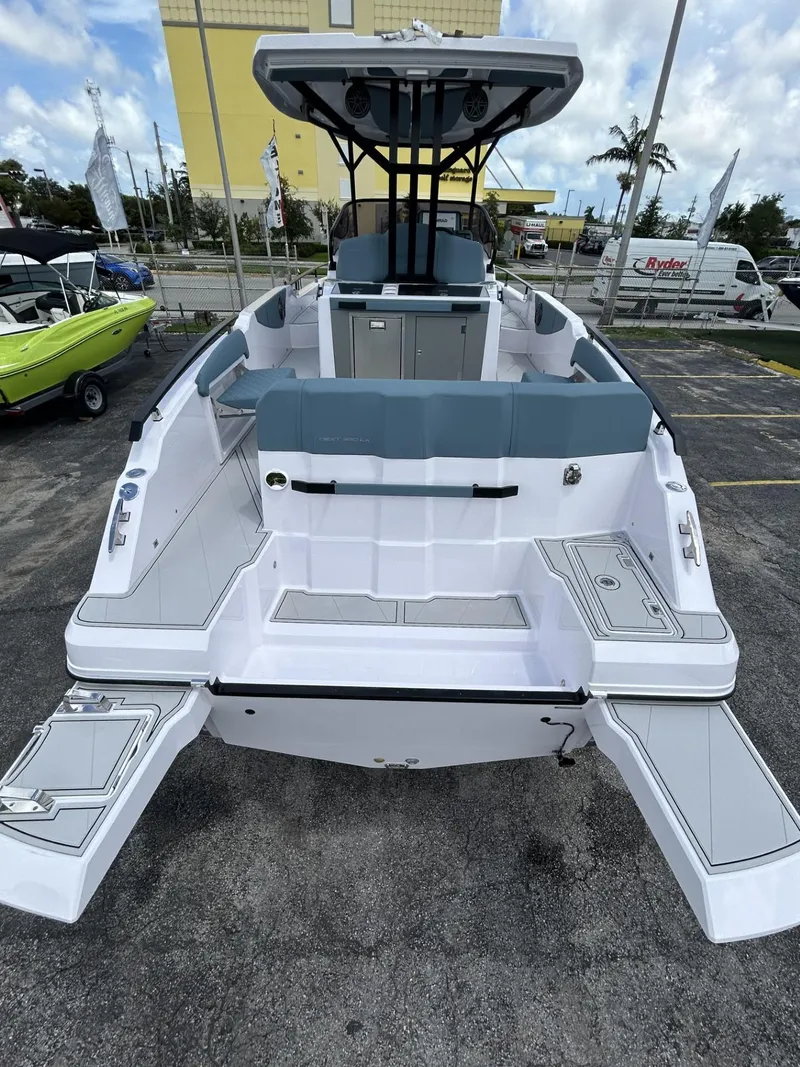 Slide: The Image of 2025 Ranieri 330LX boat, rear view, sleek design, spacious deck, modern features. - 7