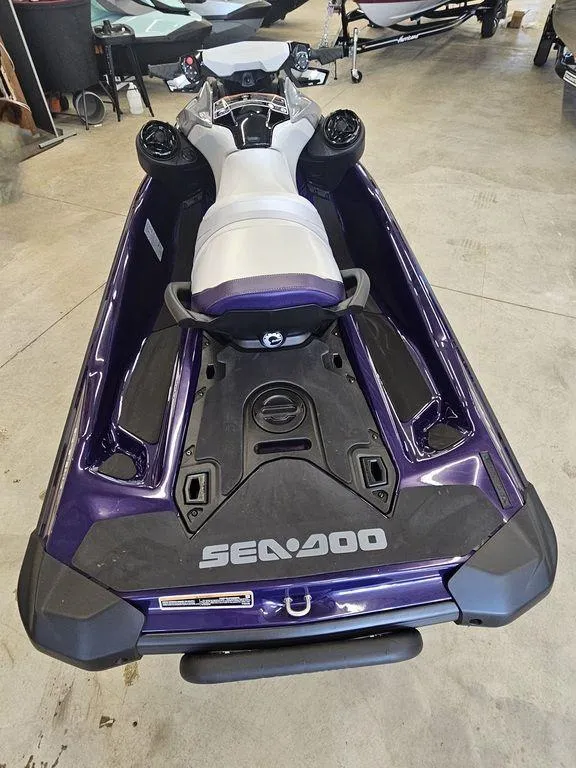 Slide: The Image of 2025 Sea-Doo GTI SE 170 jet ski with audio, iDF, and iBR features in a showroom. - 5