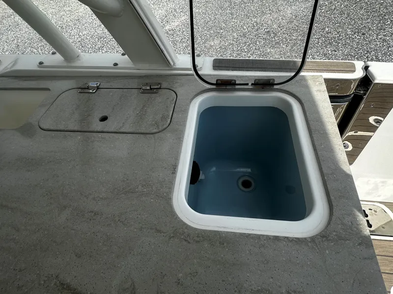 Slide: The Image of Boston Whaler 320 Vantage 2016 boat sink and countertop detail. - 13