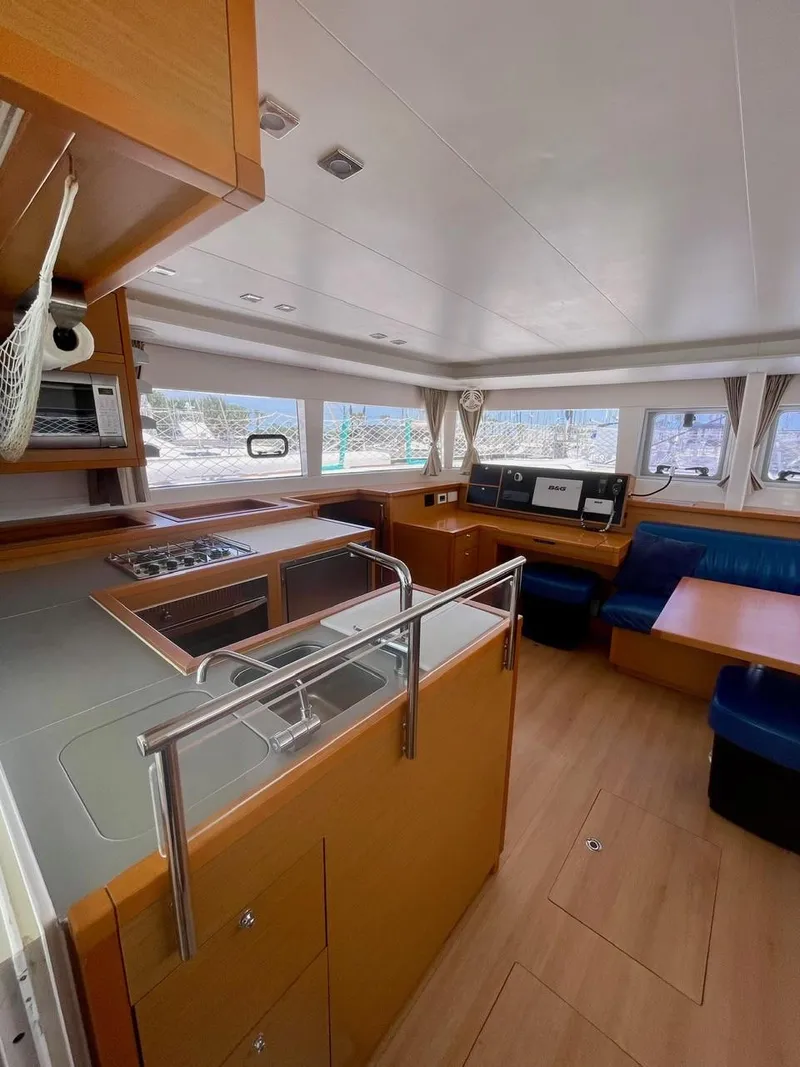 Slide: The Image of 2015 Lagoon 450 F yacht interior with modern kitchen and seating area. - 38