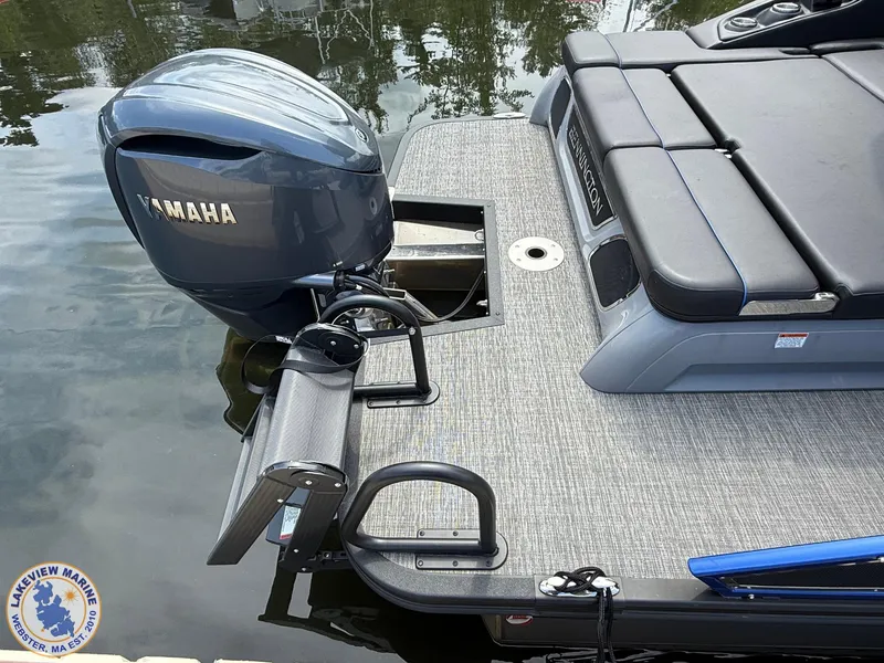 Slide: The Image of 2024 Bennington RX 23 RXSBA boat with Yamaha motor, featuring a sleek deck and seating. - 12
