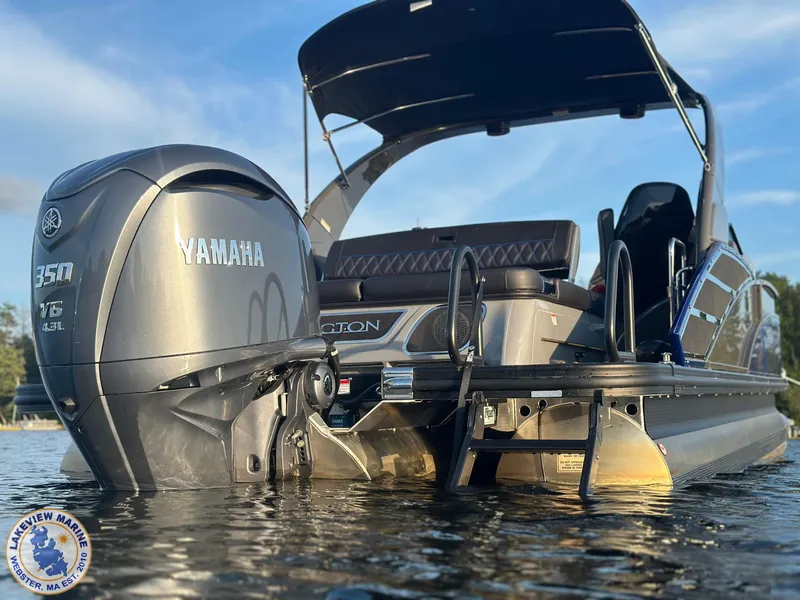 Slide: The Image of 2024 Bennington RX 23 RXSBA pontoon boat with Yamaha 350 V6 engine on water. - 2