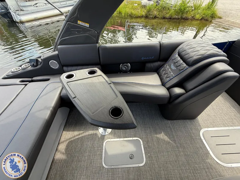 Slide: The Image of Luxurious seating on 2024 Bennington RX 23 RXSBA boat with cup holders and sleek design. - 9