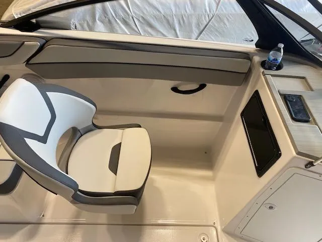 Slide: The Image of 2025 Yamaha Boats SX220 interior with modern seating and console design. - 5