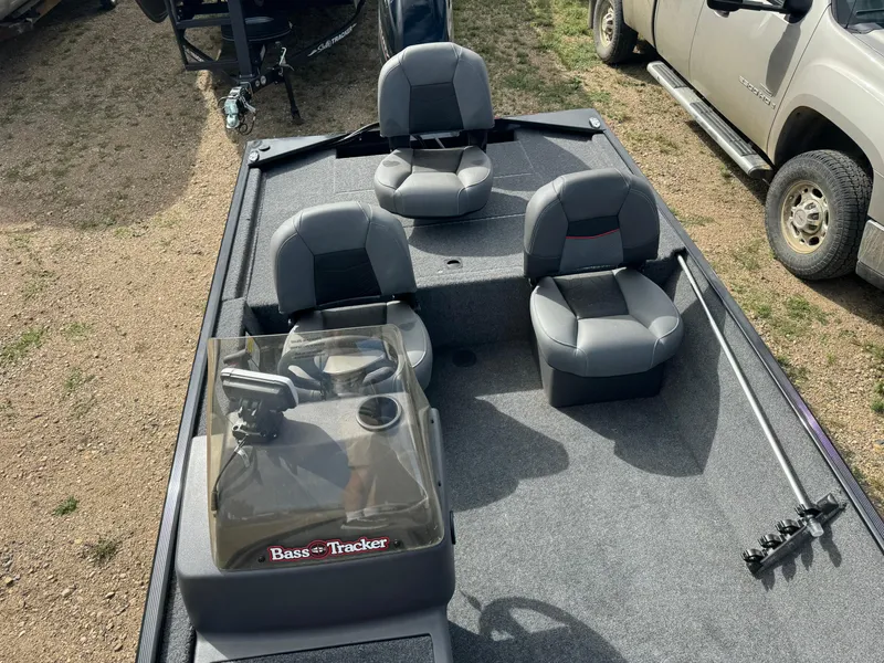 Slide: The Image of 2024 Tracker Bass Tracker Classic XL fishing boat interior with seating and console. - 14