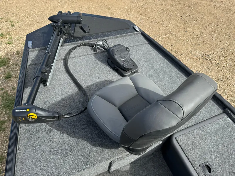 Slide: The Image of 2024 Tracker Bass Tracker Classic XL boat deck with seat and trolling motor. - 7