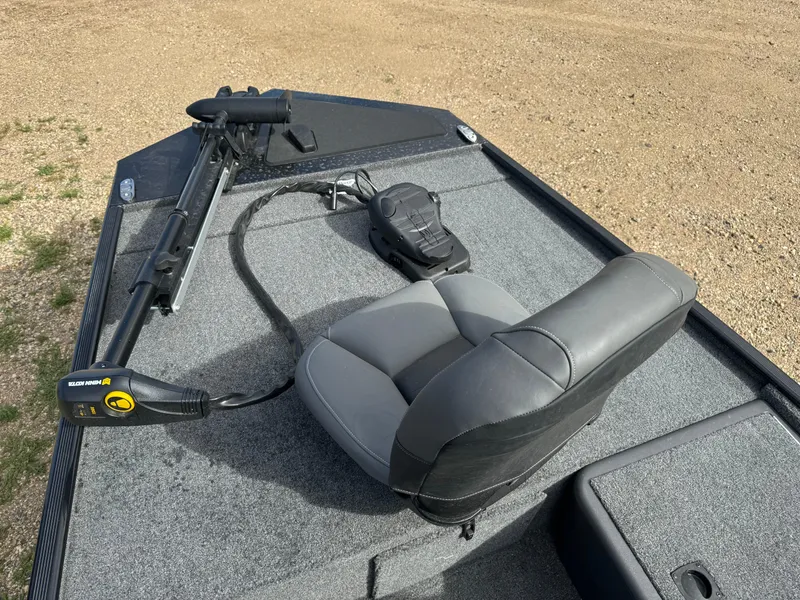 Slide: The Image of 2024 Tracker Bass Tracker Classic XL boat deck with seat and trolling motor. - 8