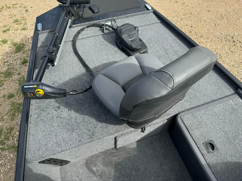 Slide: The Image of 2024 Tracker Bass Tracker Classic XL boat deck with seat and trolling motor. - 9