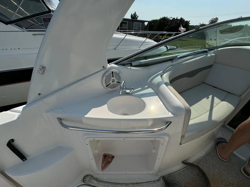 Slide: The Image of 2005 Chaparral Signature 270 boat cockpit with steering wheel and control panel. - 5