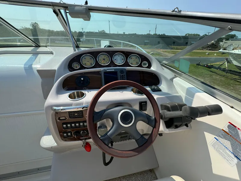 Slide: The Image of 2005 Chaparral Signature 270 dashboard with steering wheel and navigation instruments. - 7