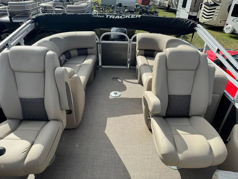 Slide: The Image of 2023 Sun Tracker Party Barge 22 XP3 interior with plush seating and spacious layout. - 12