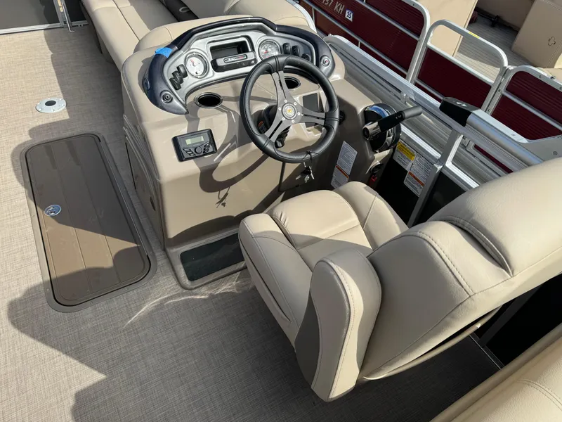 Slide: The Image of 2023 Sun Tracker Party Barge 22 XP3 interior with steering console and seating. - 16