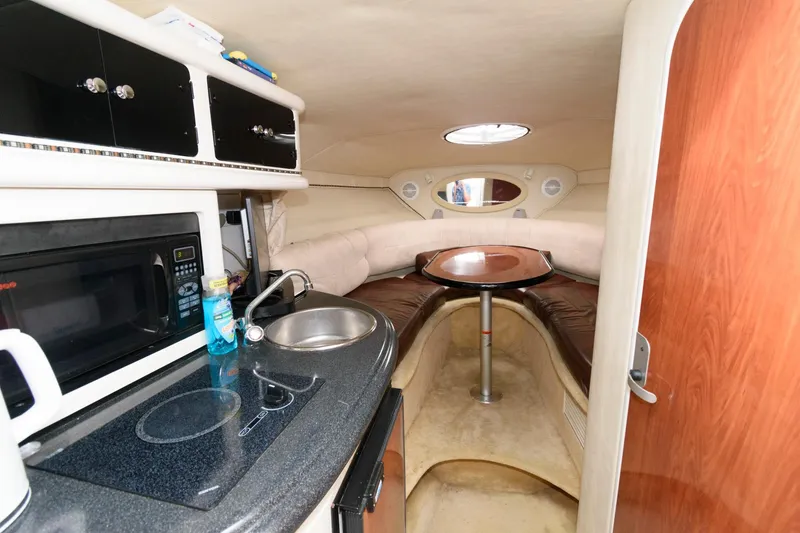Slide: The Image of 2005 Monterey 250 Cruiser interior with kitchenette and seating area. - 7