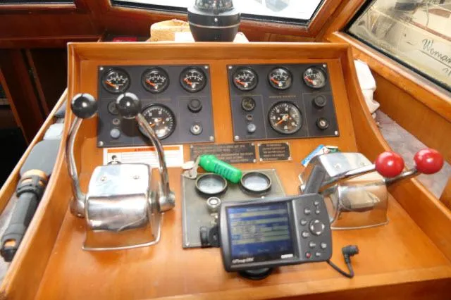 Slide: The Image of Control panel of 1986 Nova 36 SUNDECK boat with gauges and navigation equipment. - 12