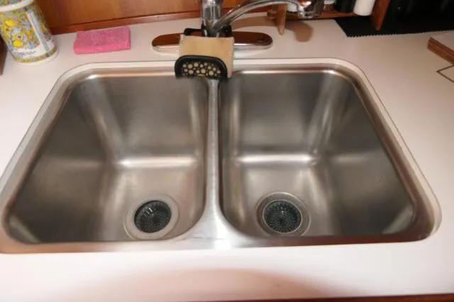 Slide: The Image of Stainless steel double sink on 1986 Nova 36 Sundeck yacht. - 21