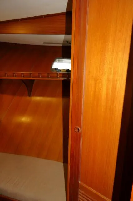 Slide: The Image of 1986 Nova 36 Sundeck interior with wooden paneling and cozy cabin space. - 30