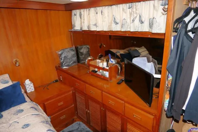 Slide: The Image of 1986 Nova 36 Sundeck interior with wooden cabinetry and cozy furnishings. - 36