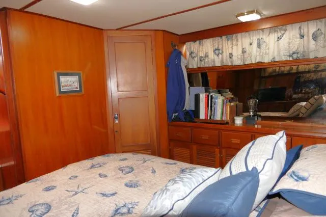 Slide: The Image of Cozy bedroom interior of 1986 Nova 36 Sundeck yacht with nautical-themed decor. - 41
