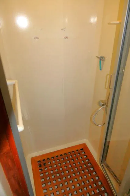 Slide: The Image of Shower area in 1986 Nova 36 Sundeck yacht with wooden floor grid. - 46