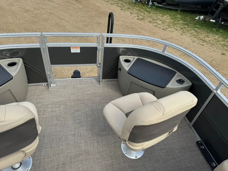 Slide: The Image of 2024 Sun Tracker Fishin' Barge 20 DLX interior with seating and fishing station. - 11
