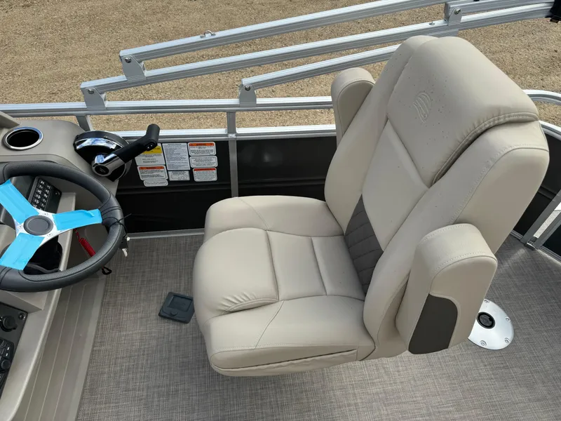 Slide: The Image of 2024 Sun Tracker Fishin' Barge 20 DLX captain's chair and steering wheel. - 14