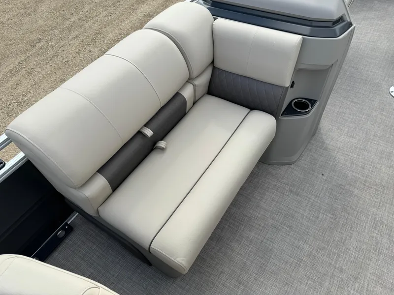 Slide: The Image of 2024 Sun Tracker Fishin' Barge 20 DLX, beige seating with cup holder, gray flooring. - 8