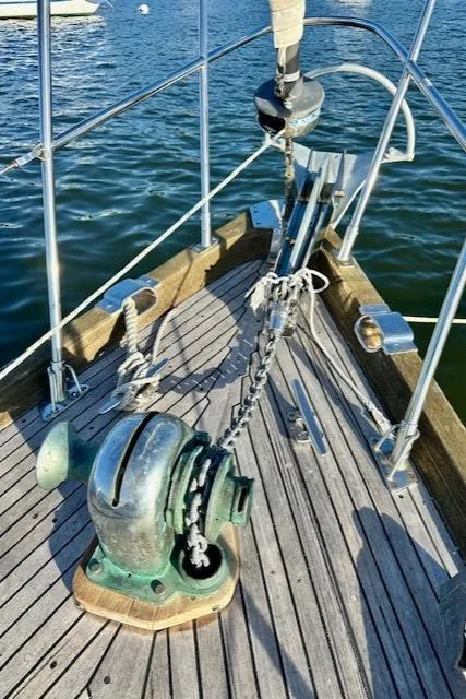 Slide: The Image of Bow of 1986 Mason 33 sailboat with anchor and winch on deck. - 11