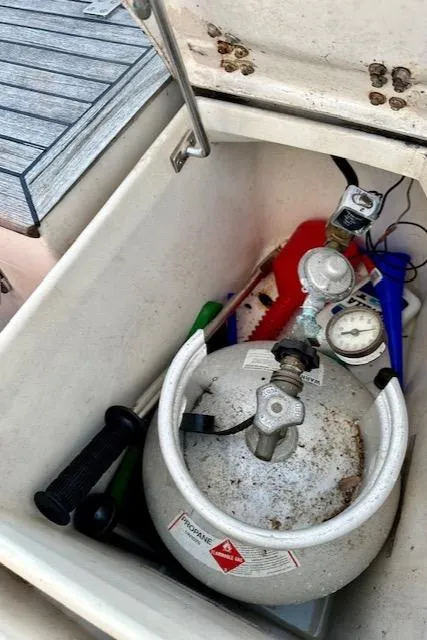 Slide: The Image of Propane tank in storage compartment of 1986 Mason 33 boat. - 25
