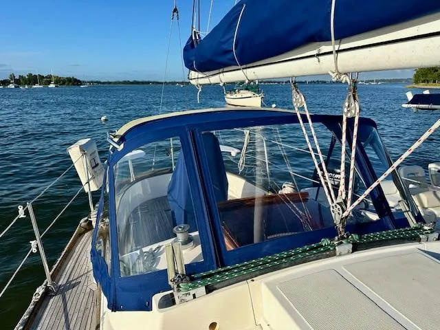Slide: The Image of Sailboat on water, Mason 33 model, 1986, with blue canopy and clear skies. - 4