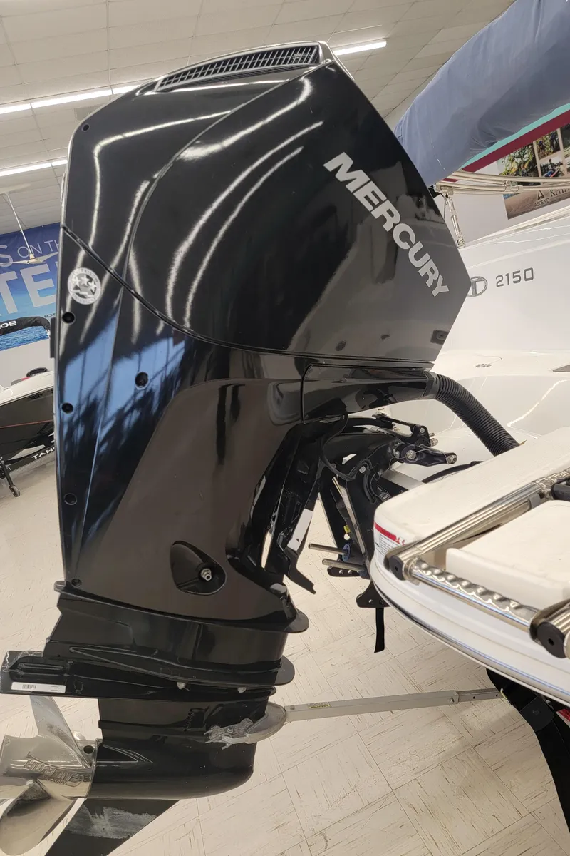 Slide: The Image of 2019 Tahoe 2150 OB with Mercury outboard motor in showroom. - 2
