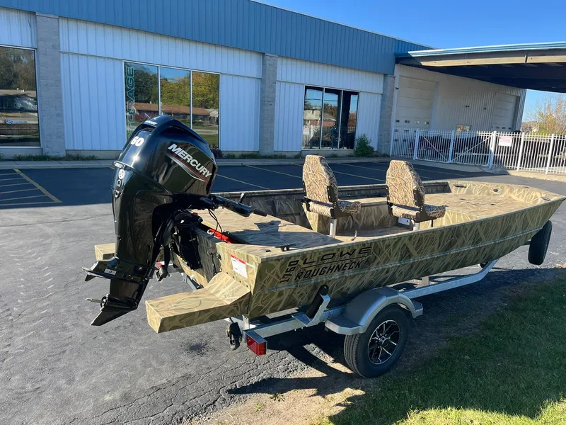 Slide: The Image of 2025 Lowe Roughneck 1760 boat with Mercury engine on trailer, parked outdoors. - 3