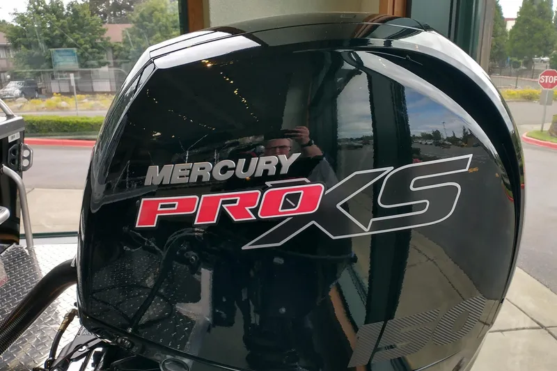 Slide: The Image of Mercury Pro XS engine on 2024 Spartan 185 Astoria boat, outdoor setting. - 9