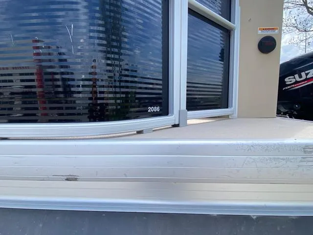 Slide: The Image of Control panel of a 2020 Godfrey SW2086F boat with throttle and navigation system. - 11