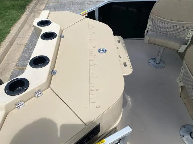 Slide: The Image of Luxurious 2020 Godfrey SW2086F boat interior with plush seating and steering console. - 7