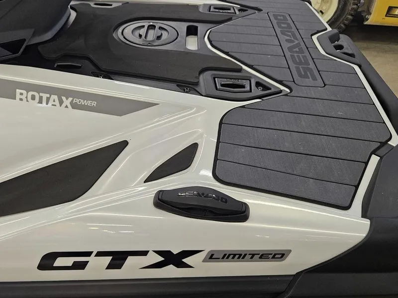 Slide: The Image of 2025 Sea-Doo GTX Limited 325, White Pearl Premium, close-up of Rotax power and deck design. - 5