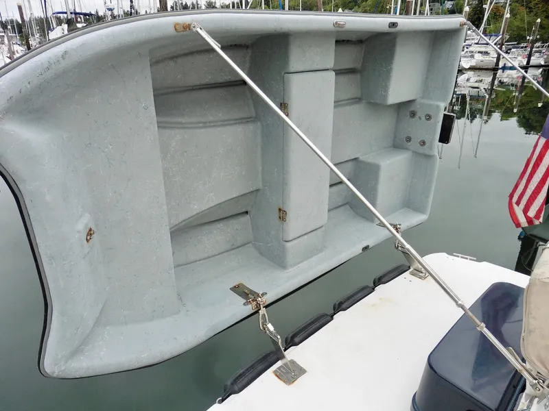 Slide: The Image of 2015 Cutwater 30CB boat with a raised dinghy on deck. - 13