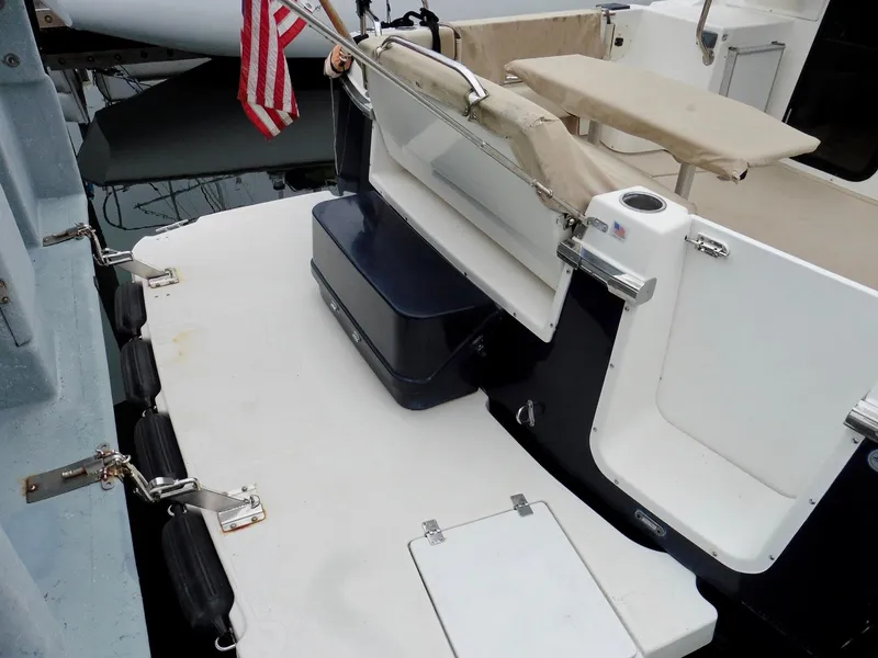 Slide: The Image of 2015 Cutwater 30CB boat deck with seating and American flag. - 14