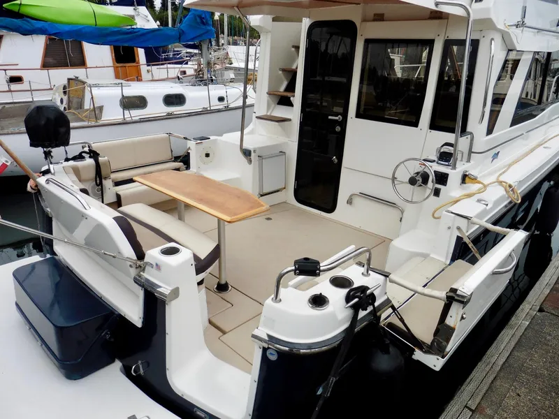 Slide: The Image of 2015 Cutwater 30CB boat with spacious deck and seating area. - 15