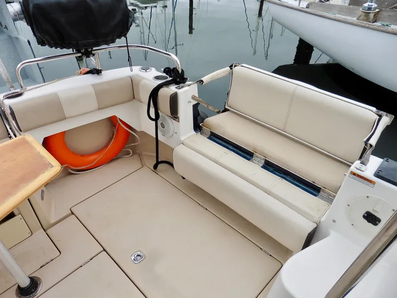 Slide: The Image of 2015 Cutwater 30CB boat interior with seating and life preserver. - 19